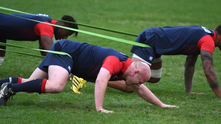 TOPSHOT - England rugby player Dan Cole (C) stretches with teammates as they train in Sydney on June 20, 2016, after England defeated the Australian Wallab