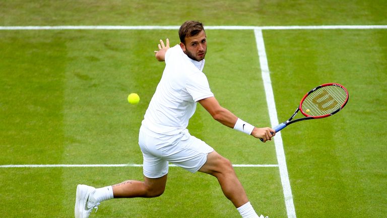  Dan Evans of Great Britain reaches for a backhand