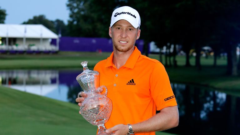 Daniel Berger celebrates with the trophy after winning the FedEx St. Jude Classic during the final round at TPC Southwind on June 1