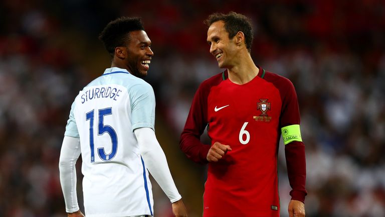 LONDON, ENGLAND - JUNE 02:  Daniel Sturridge of England and Ricardo Carvalho of Portugal smile during the international friendly match between England and 