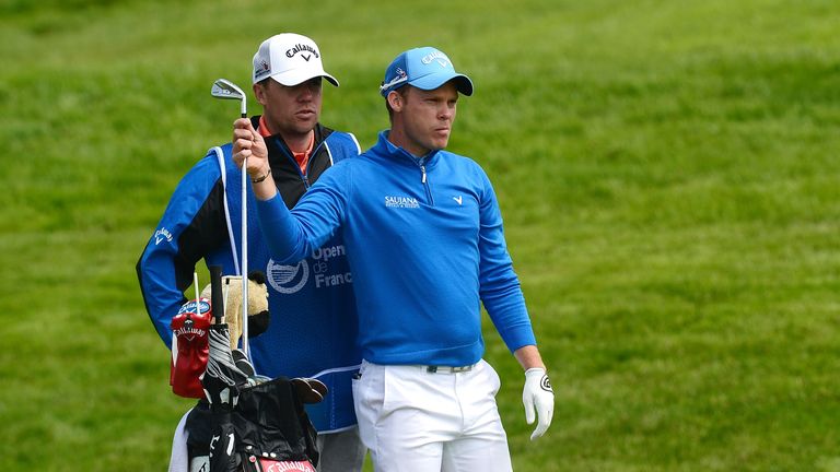 PARIS, FRANCE - JUNE 30:  Danny Willett of England pulls a club as his caddie Jonathan Smart looks on during the first round of the 100th Open de France at