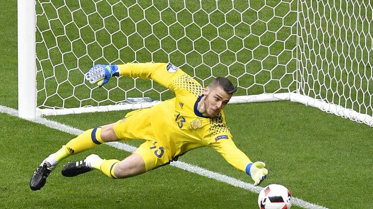 Spain's goalkeeper David De Gea dives for the ball during Euro 2016 round of 16 football match between Italy and Spain 