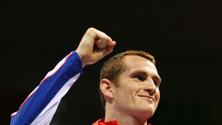 BEIJING - AUGUST 24:  Bronze medalist David Price of Great Britain receives his medal following the Men's Super Heavy (+91kg) Final Bout held at the Worker