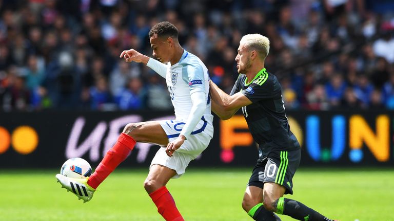 Dele Alli of England controls the ball under pressure of Aaron Ramsey of Wales during the UEFA EURO 2016 Group B match between Engl