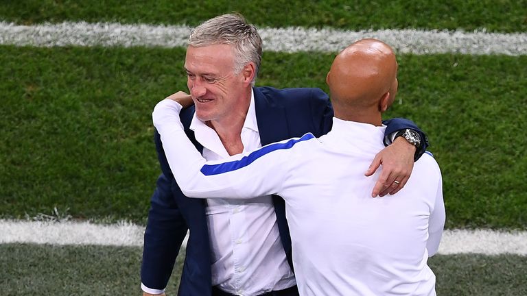 France's coach Didier Deschamps (L) reacts after the Euro 2016 group A football match between France and Albania at the Velodrome stadium in Marseille on J