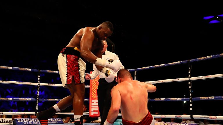 LONDON, ENGLAND - JUNE 25:  Dillian Whyte of Great Britain knocks down Ivica Bacurin of Croatia during their Heavyweight contest at The O2 Arena on June 25