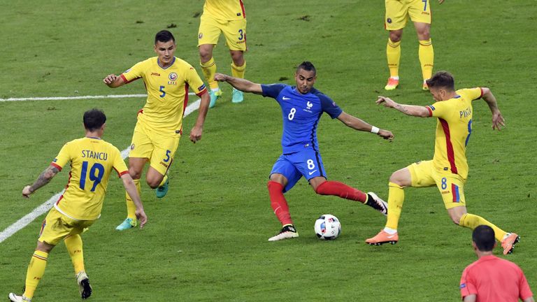 France's forward Dimitri Payet (C) aims to score a goal past Romania's forward Bogdan Stancu (L) and Romania's midfielder Ovidiu Hoban (2nd L) and Romania'