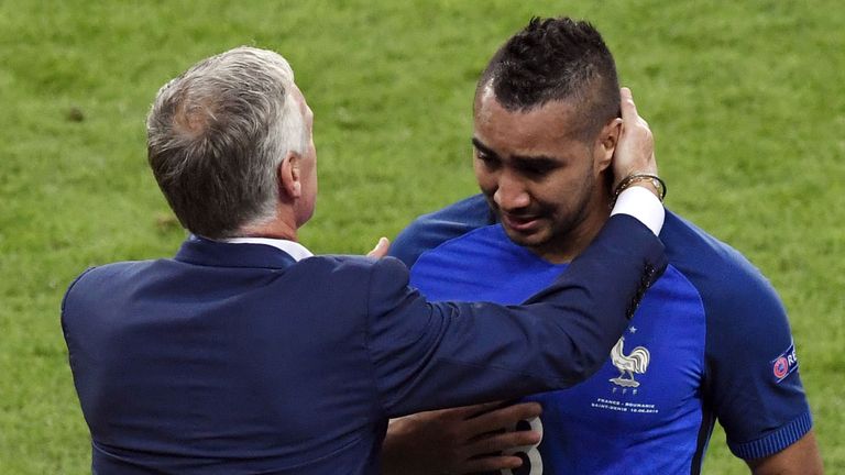 France's forward Dimitri Payet (R) is congratulated by France's coach Didier Deschamps  after scoring the 2-1 goal during the Euro 2016 group A football ma
