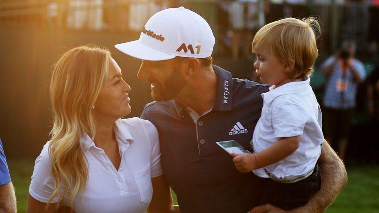 Dustin Johnson of the United States celebrates with partner Paulina Gretzky and son Tatum after winning the U.S. Open at Oakmont