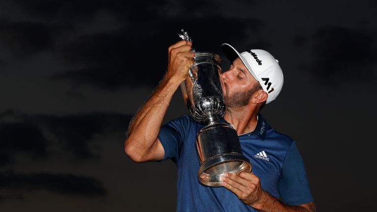 Dustin Johnson celebrates with his first major trophy at Oakmount