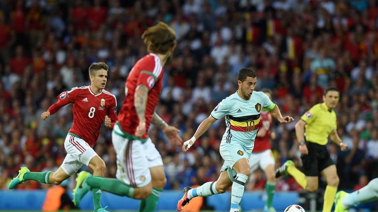 Belgium's forward Eden Hazard (R) dribbles the ball during the Euro 2016 round of 16 football match