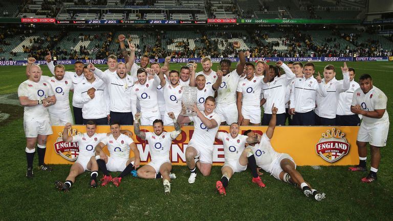 England's Dylan Hartley holds the Cooks cup and celebrates with his team after their rugby test match 