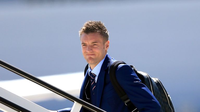 England's Jamie Vardy boards the plane at Luton Airport.