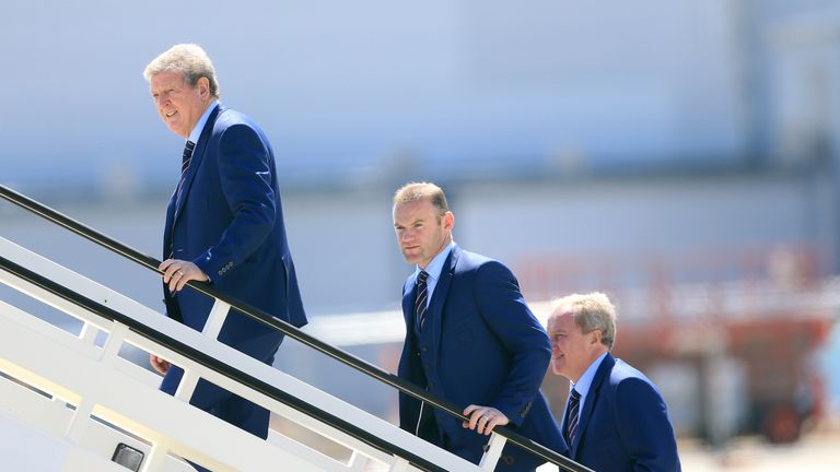 England manager Roy Hodgson, captain Wayne Rooney and assistant manager Ray Lewington board the plane at Luton Airport.