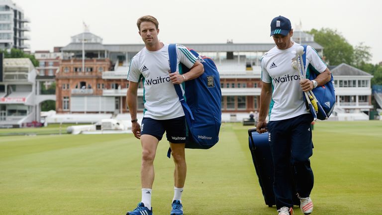 Nick Compton of England walks across the field at Lord's alongside batting coach Mark Ramprakash