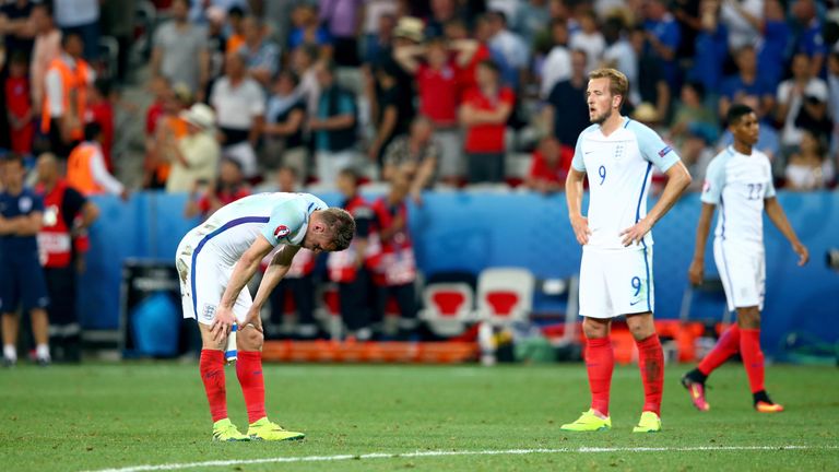 Jamie Vardy (L) and Harry Kane (R) of England show their dejection