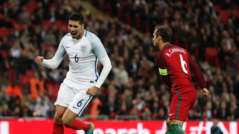 England defender Chris Smalling (L) celebrates after scoring against Portugal