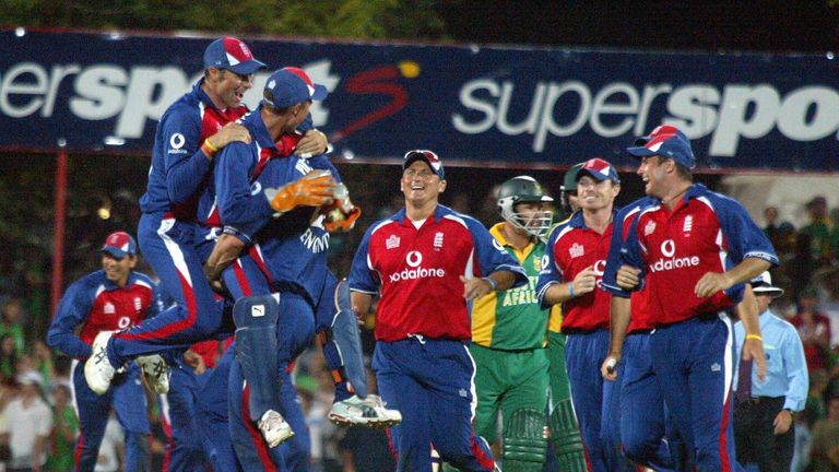 England cricketers celebrate after South African batsman Andrew Hall (C) was stumped with the final ball at close of play