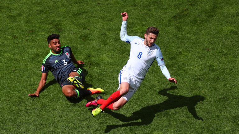 LENS, FRANCE - JUNE 16:  Neil Taylor of Wales tackles Adam Lallana of England during the UEFA EURO 2016 Group B match between England and Wales at Stade Bo
