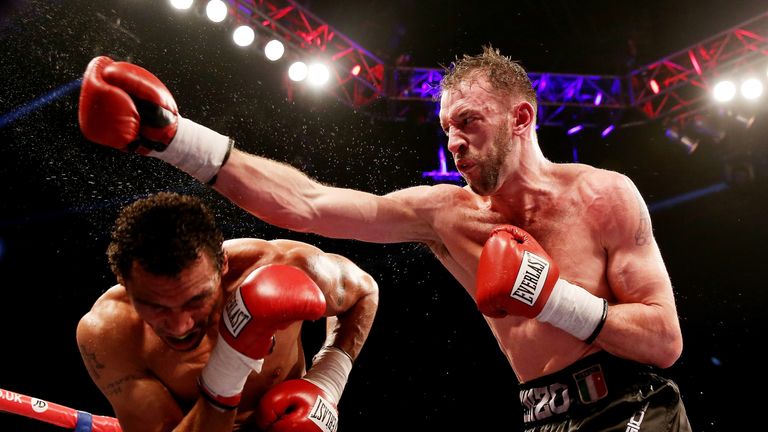 Enzo Maccarinelli (R) in action with Courtney Fry during their Commonwealth light Heavyweight