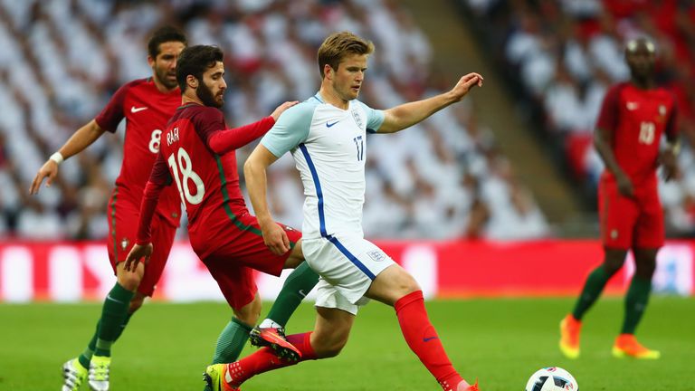 Eric Dier of England is watched by Rafa Silva of Portugal 