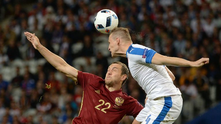 Slovakia's defender Jan Durica vies for the header with Russia's forward Artem Dzyuba during the Euro 2016 group B football match between Russia and Slovak