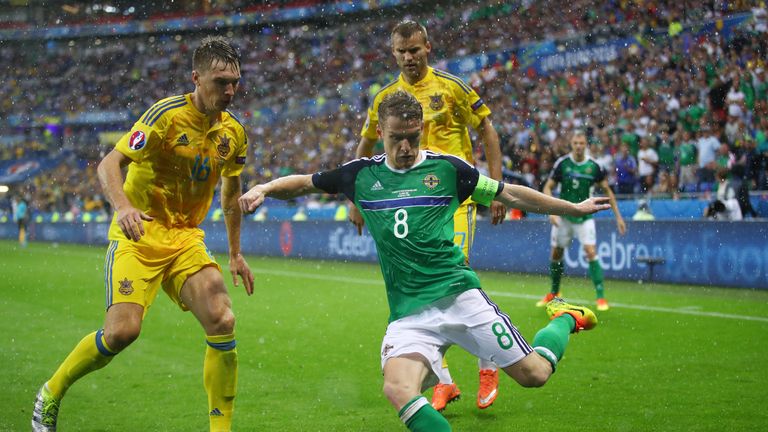 Steven Davis of Northern Ireland and Serhiy Sydorchuk of Ukraine compete for the ball 