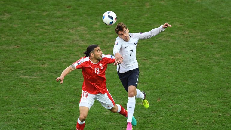 Antoine Griezmann of France and Ricardo Rodriguez of Switzerland compete for the ball