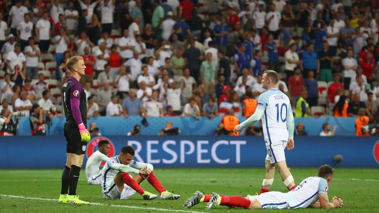 Wayne Rooney of England (2nd R) walks toward Dele Alli (3rd L) to console after the UEFA EURO 2016 round of 16 match between England and Iceland