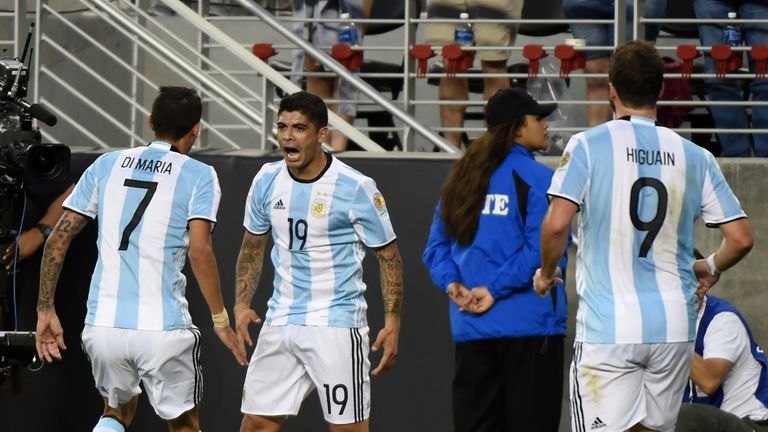 Argentina's Ever Banega (c) celebrates with teammates after scoring against Chile