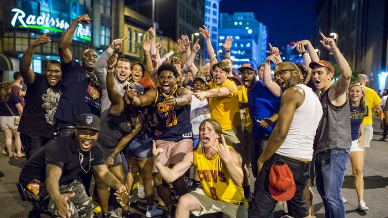 Cavaliers' fans celebrate in the streets of Cleveland following their team's momentous victory in the NBA finals