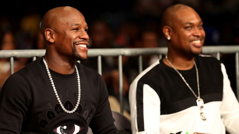 Floyd Mayweather looks on from ringside