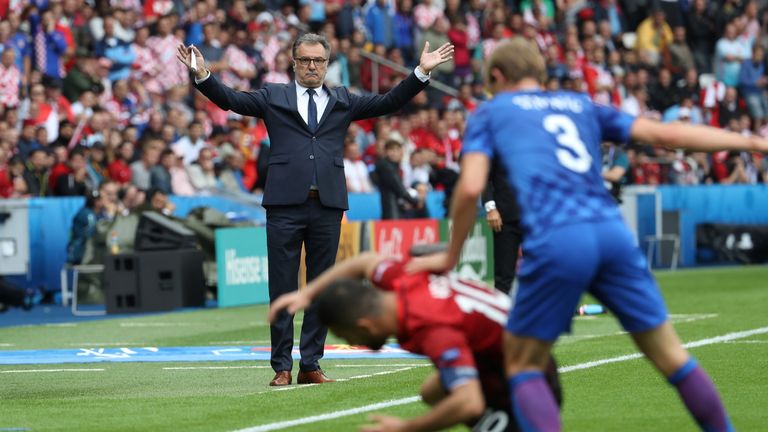 Croatia's coach Ante Cacic gestures as he watches Turkey's midfielder Arda Turan (C) and Croatia's defender Ivan Strinic fight for the ball