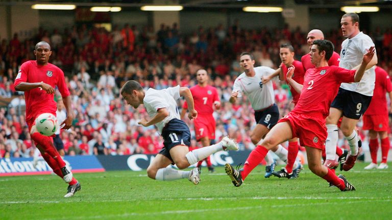 Joe Cole of England goes close to scoring a diving header during the 2006 World Cup Qualifying match between Wales