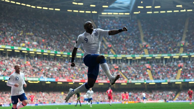 England's striker Darren Bent celebrates scoring a goal during their Euro 2012, group G qualifying football match against Wales at the Millennium Stadium