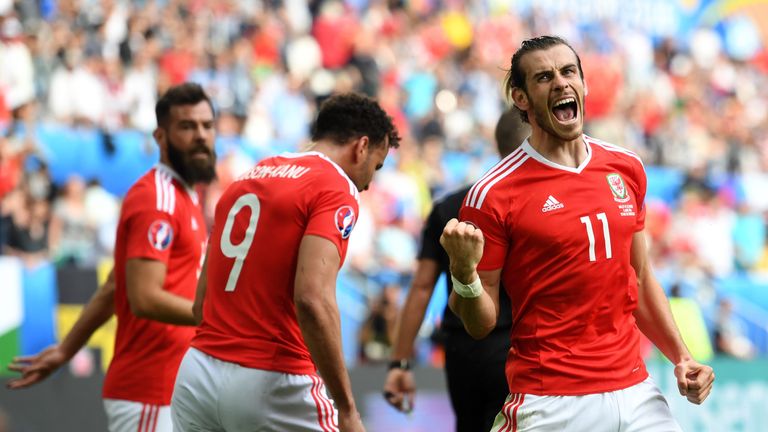 BORDEAUX, FRANCE - JUNE 11: Wales player Gareth Bale (R) of Wales celebrates his team's second goal scored by Hal Robson-Kanu (C) as Joe Ledley (l) looks o