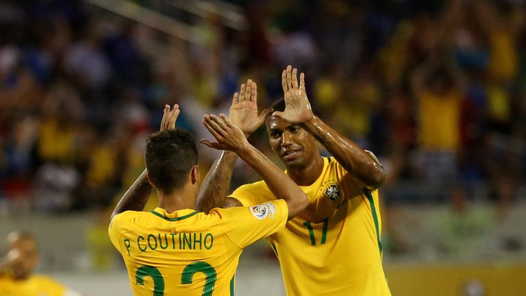Philippe Coutinho and Walace celebrate