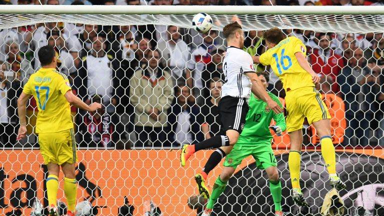 Germany's defender Shkodran Mustafi (C) scores a goal during the Euro 2016 group C football match between Germany and Ukraine