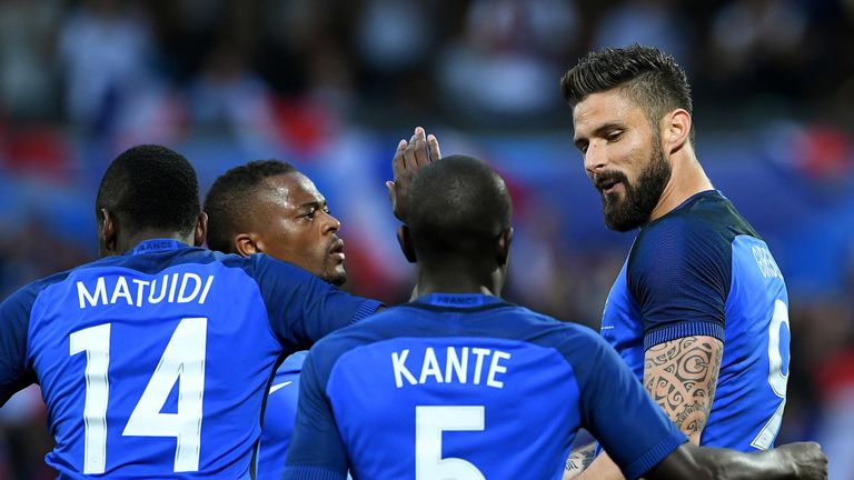 France's forward Olivier Giroud (1st-R) celebrates his goal during the friendly football match between France and Scotland