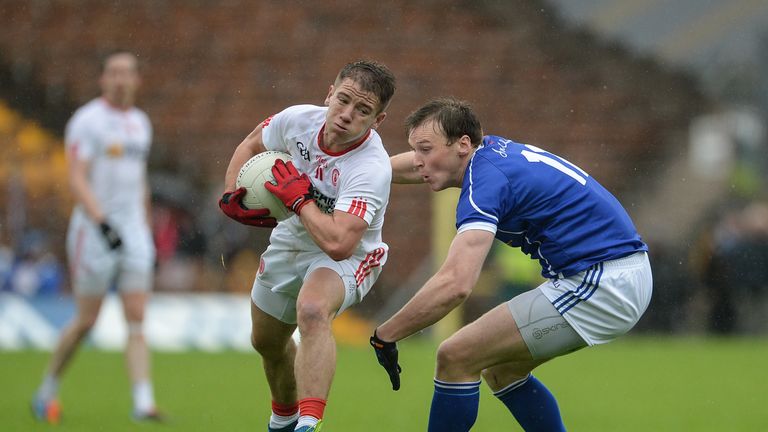 Mark Bradley of Tyrone in action against Gearoid McKiernan of Cavan