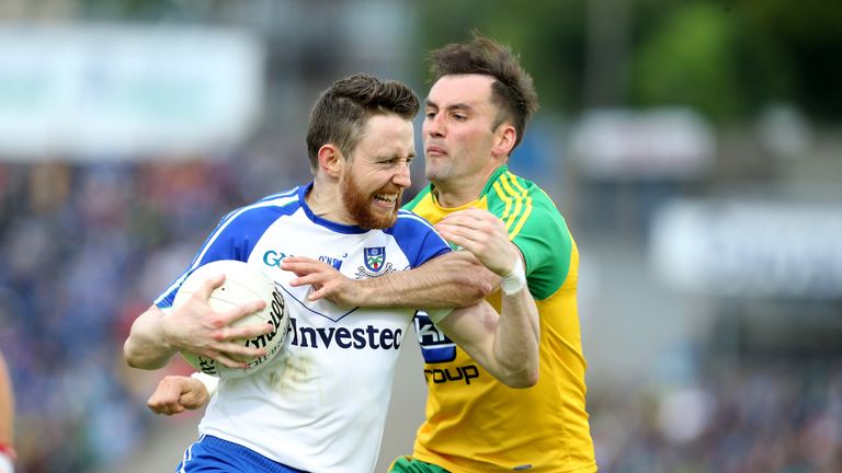 Monaghan's Owen Duffy is tackled by Karl Lacey
