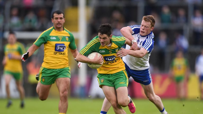 Ryan McHugh is tackled by Ryan McAnespie of Monaghan