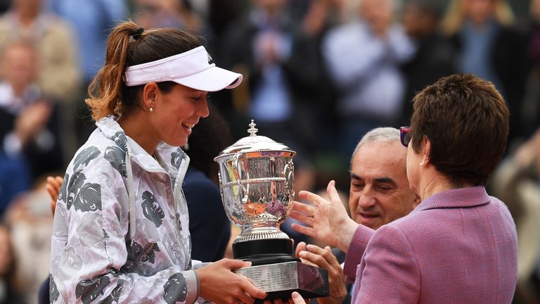 PARIS, FRANCE - JUNE 04:  Garbine Muguruza of Spain receives the trophy from Billie Jean King following her victory during the Ladies Singles final match a