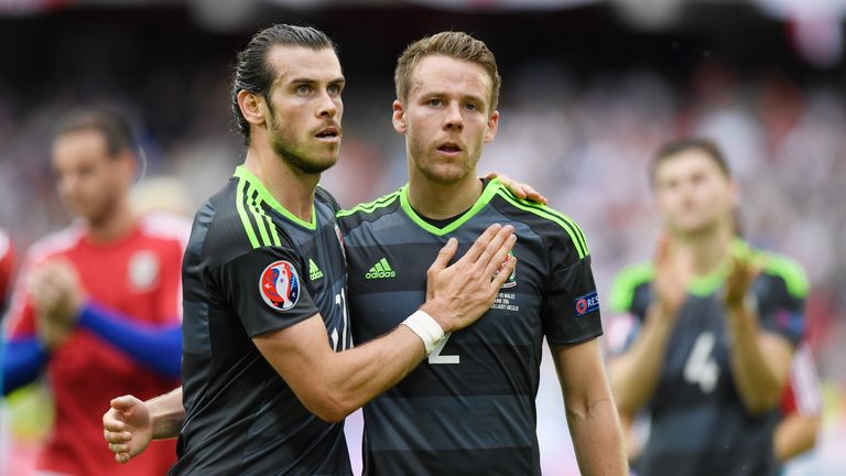 Gareth Bale and Chris Gunter of Wales react after their 1-2 defeat to England