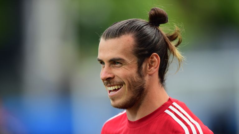 Wales player Gareth Bale shares a joke with team mates during training ahead of their Euro 2016 match against England in Lens