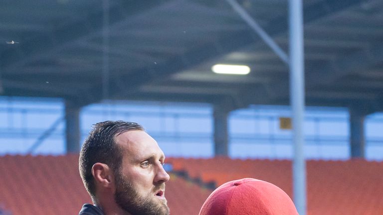 Leigh's Gareth Hock with the Centurions mascot.