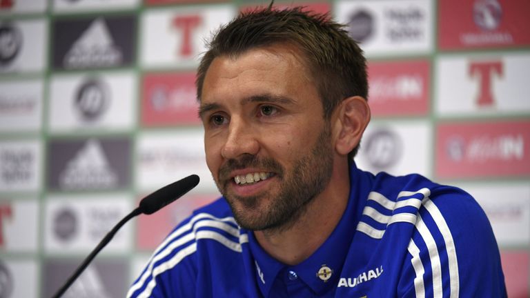 Northern Ireland's defender Gareth McAuley addresses a press conference at the team's training ground in Saint George de Reneins