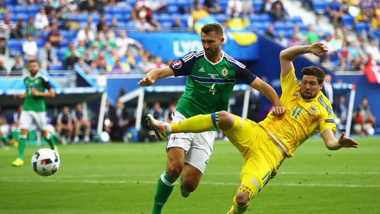 Gareth McAuley puts Yevhen Seleznyov under pressure