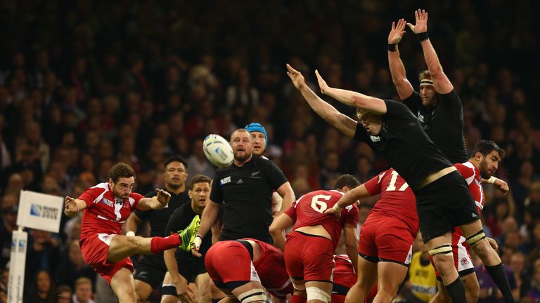  Vasil Lobzhanidze of Georgia kicks clear as Brodie Retallick tries to block during the 2015 Rugby World Cup