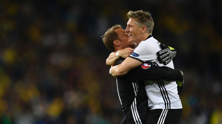 Germany's midfielder Bastian Schweinsteiger (R) celebrates with Germany's goalkeeper Manuel Neuer after scoring a goal during the Euro 2016 group C footbal